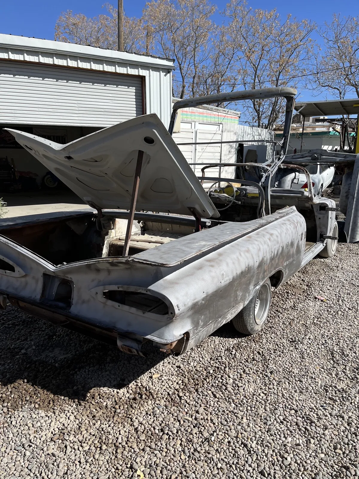 The same El Camino blasted to clean bare steel.