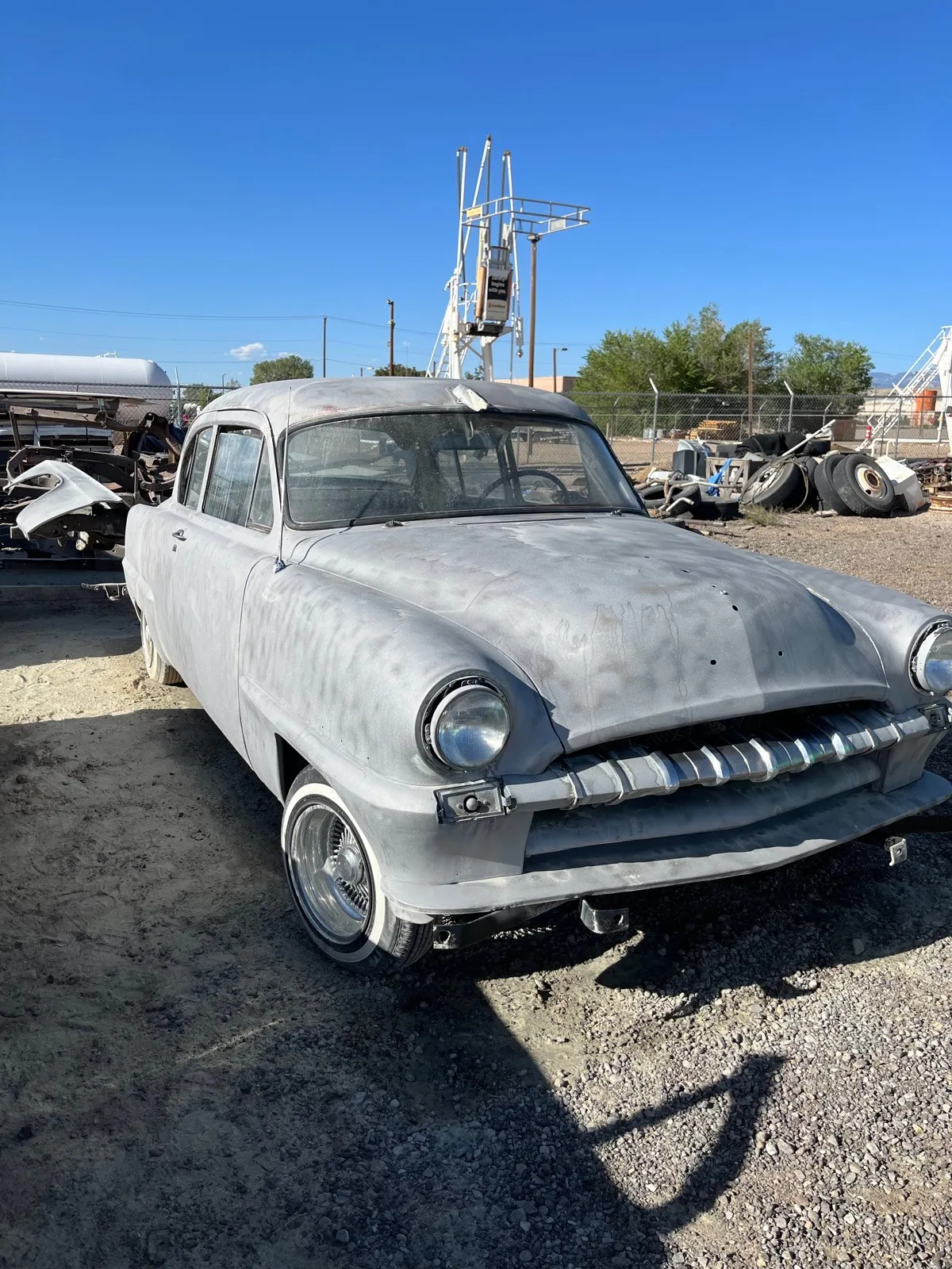 The same 1953 Plymouth blasted to even bare metal, ready for primer.