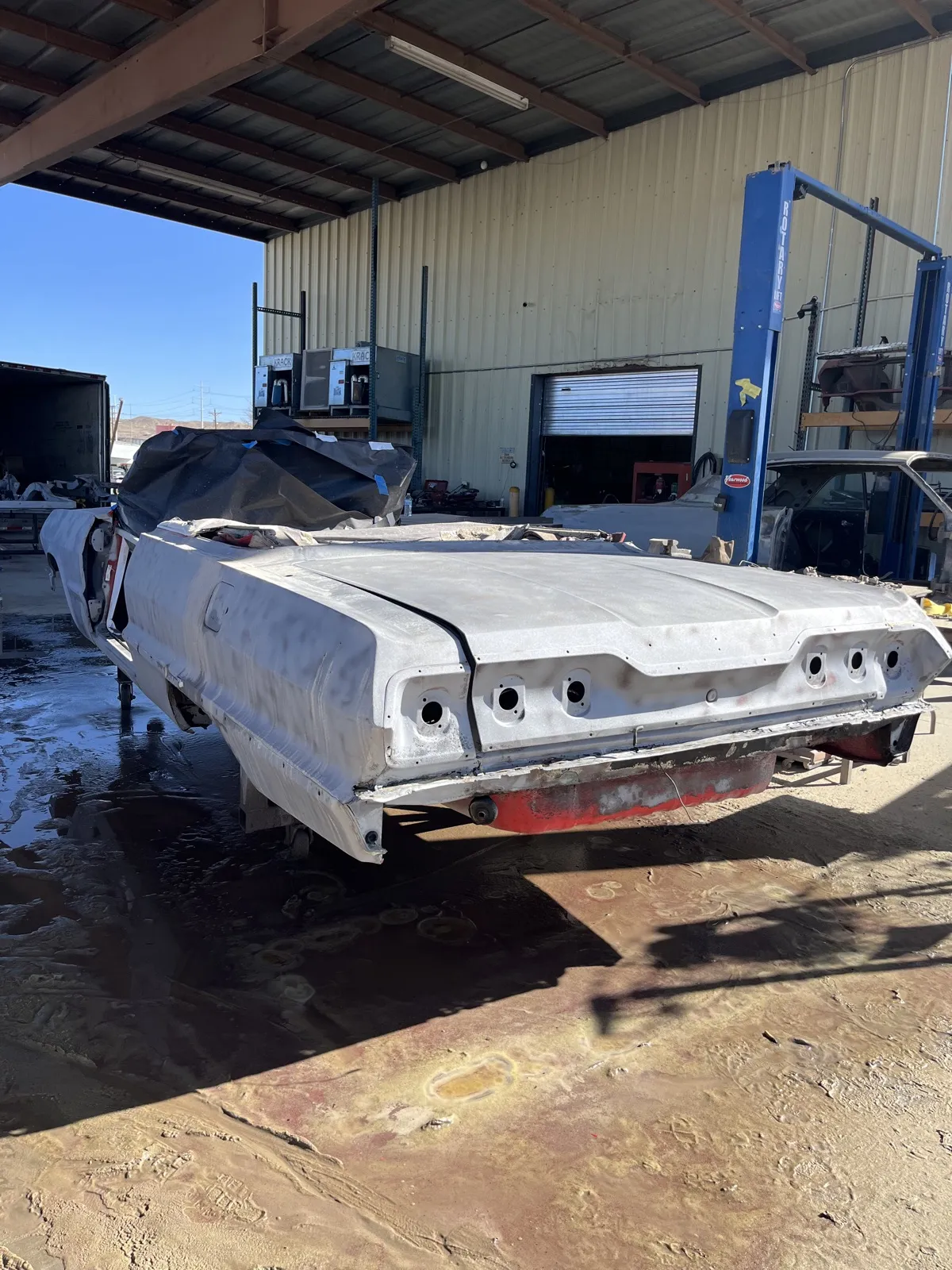 The same rear deck blasted to clean bare metal.